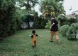 Father and child playing football
