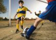 little boy playing football